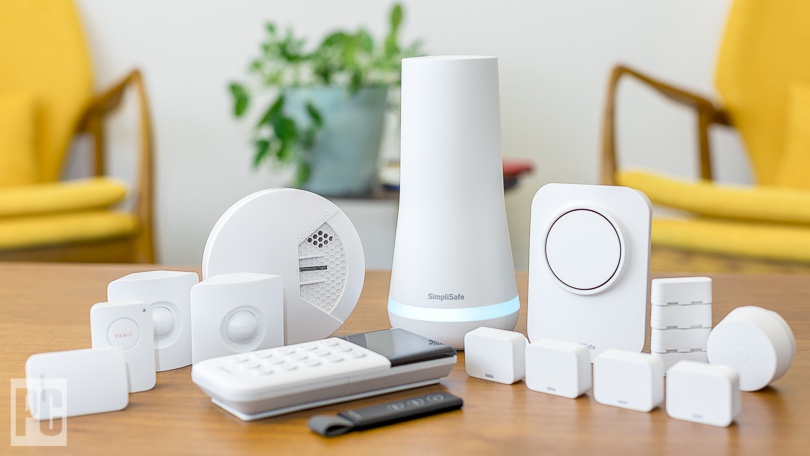 SimpliSafe sensors being installed on a wall